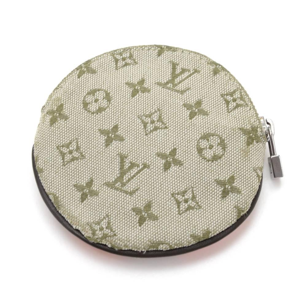 Louis Vuitton Conte De Fees Porte Monnaie Round coin case in mini Monogram canvas. It is from 2002 Limited Edition. It can be used in either way as you please.

Made in: France
Serial Number: MI0062
Size: 3.7 x 3.7 x 0 inches or 9.5 x 9.4 x 0