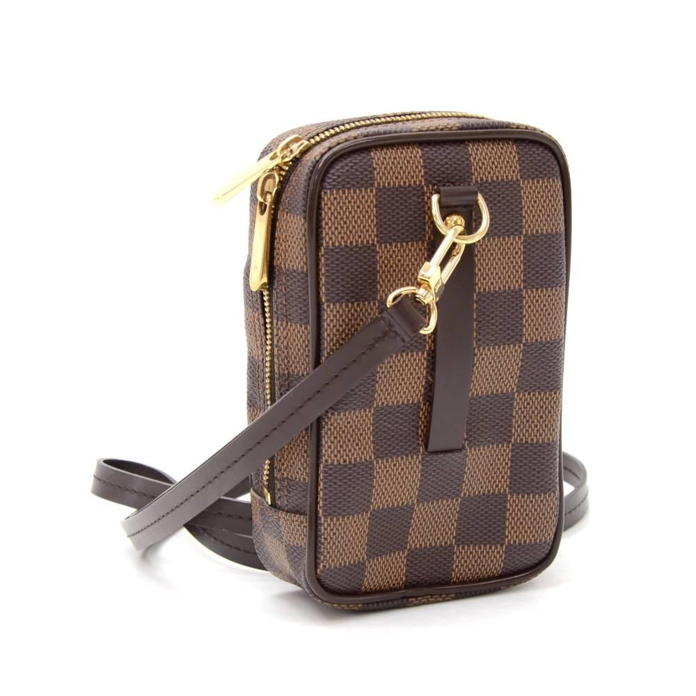 This is Louis Vuitton Okapi PM case in Damier canvas. It has double zipper closure with 1 exterior and interior open pocket. Practical and perfect for your digital camera.

Made in: France
Serial Number: S N 1 0 5 8
Size: 3 x 4.3 x 1.6 inches or 7.5
