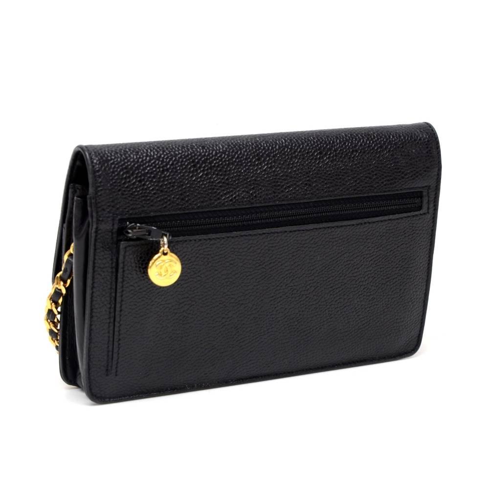 Chanel black caviar leather wallet on chain. It has flap top with a secure stud and 1 zipper pocket on the back. Inside has １exterior open pocket, 1 compartment for coin with zipper closure, 2 note compartments, and 6 card holders. It has long chain
