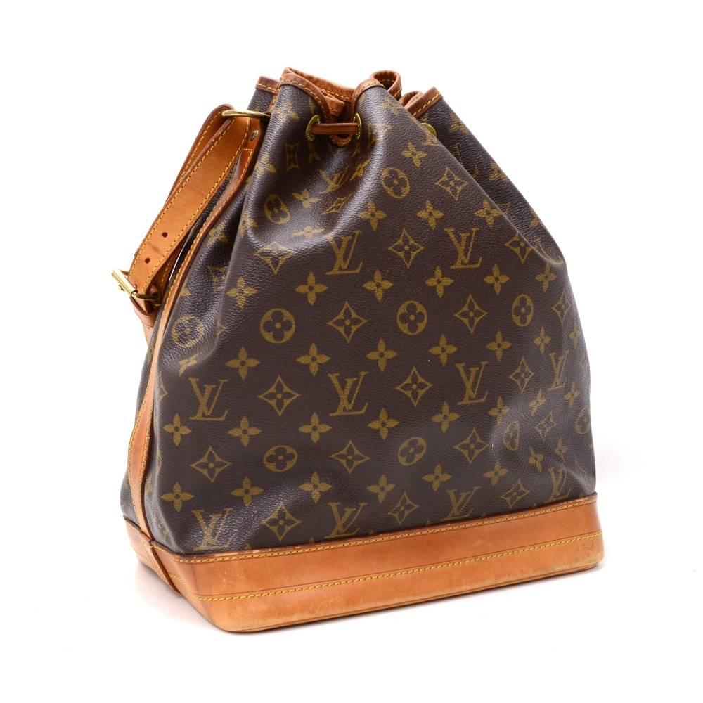 Louis Vuitton Noe shoulder bag. It has adjustable shoulder strap and tie up string closure. Inside is brown lining. The famous champagne bag created in 1932 which makes it a true classic.

Made in: France
Serial Number: S P 1 9 0 5
Size: 10.2 x 13.4