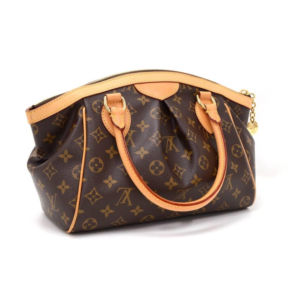 Louis Vuitton Tivoli PM handbag in Monogram canvas. Top is closed with zipper. Inside has brown fabric lining and 1 open pocket and 1 for mobile or glasses. It is specially designed to keep all your items perfectly organized!

Made in: France
Serial