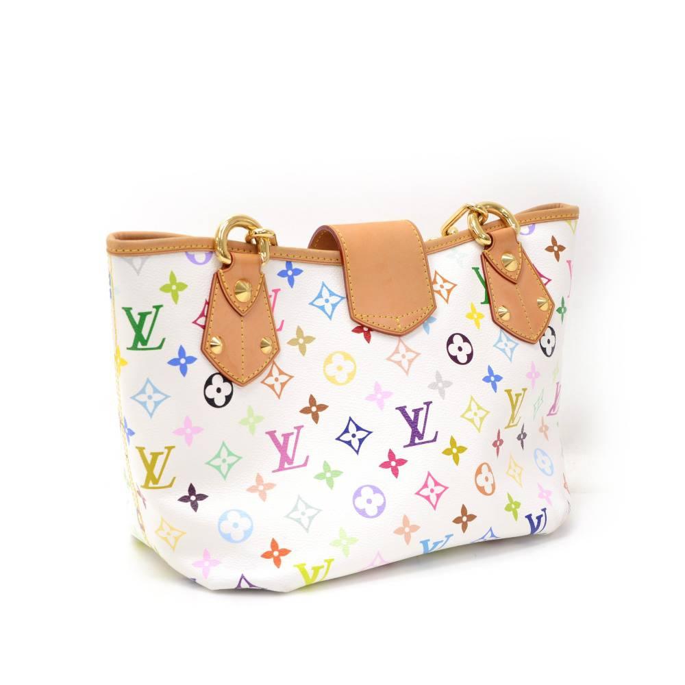 Louis Vuitton Annie MM bag in white multicolor monogram canvas. Top is secured with leather belt and twist lock. Inside has red leather lining with 1 zipper pocket. Great for daily use.

Made in: France
Serial Number: SR0161
Size: 12.6 x 7.9 x 6.7