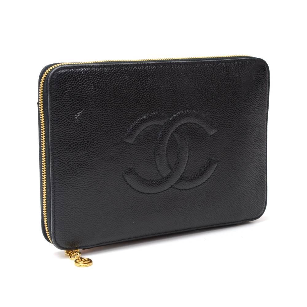 Chanel organizer wallet in black caviar leather. It is secured with full-round zipper closure. Inside has 1 coin compartment secured with zipper, 2 note compartments, 3 open pocket and 10 card slip in pockets. Stunning classic design! 

Made in: