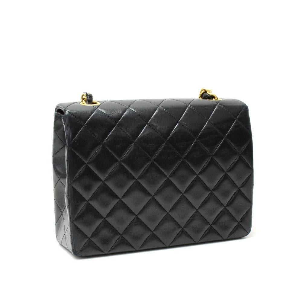 Chanel black quilted leather mini bag. It has flap and CC twist lock on the front. Inside has Chanel red leather lining and 2 pockets; 1 zipper and 1 open slit into 3 compartment. It can be used as shoulder bag or across the body.

Made in: