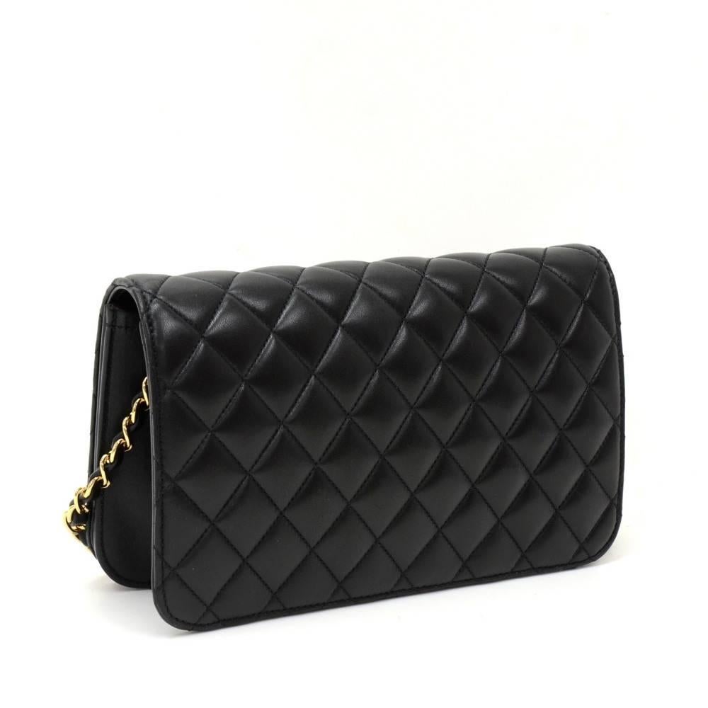 Chanel Black leather quilted shoulder bag. It has a flap with famous CC twist closure on the front. Inside has Chanel red leather lining with 1 zipper pocket. It can be carried on shoulder.

Made in: France
Serial Number: 14209254
Size: 9.1 x 5.5 x