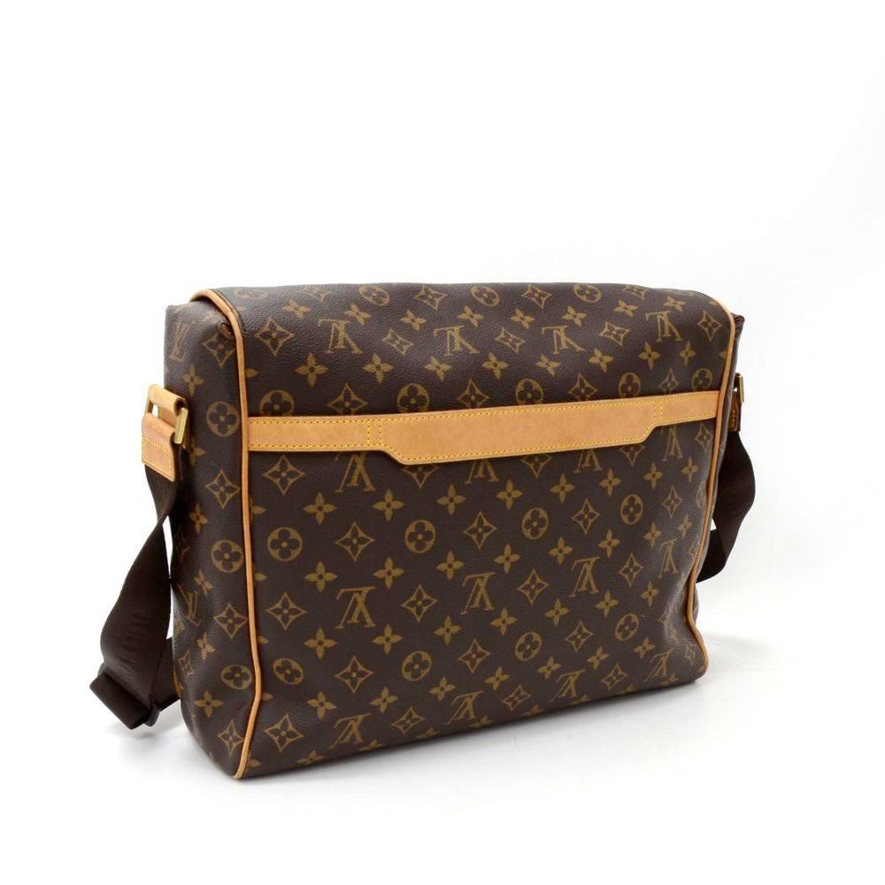 Louis Vuitton Abbesses bag in monogram Canvas. Outside, it has 1 small open pocket in the back. Top secured with flap. Under beneath it, it has 2 exterior open pockets. Inside has 1 zipper, 1 open pocket and 1 for mobile or glasses. Very practical