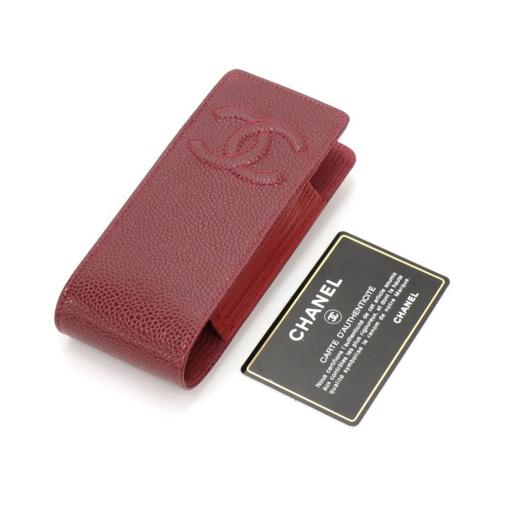 Chanel red caviar leather case/pouch to carry phone, cigarettes or digital cameras. Inside is in textile lining. Very smart and stylish. 

Made in: France
Serial Number: 7468331
Size: 5.5 x 2.4 x 1.2 inches or 14 x 6 x 3 cm
Color: Red
Dust bag:  