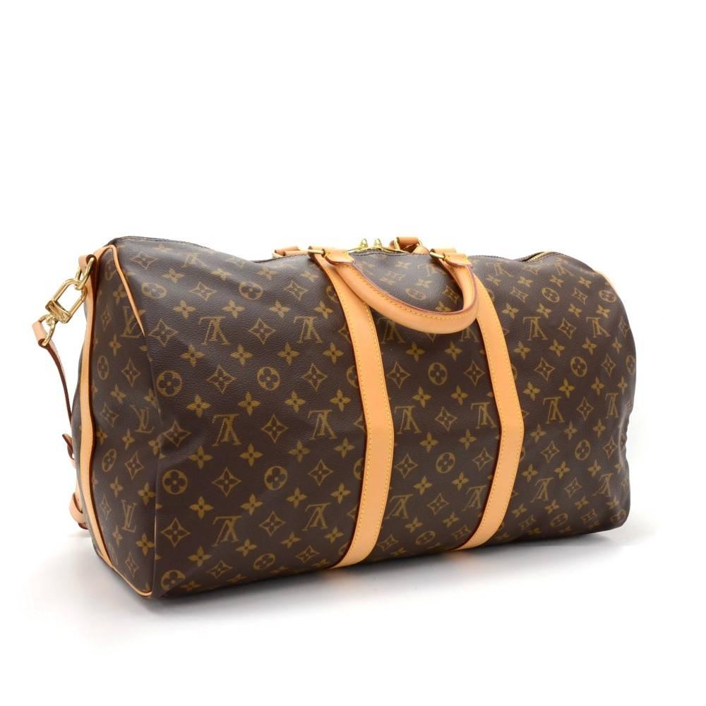 Louis Vuitton Keepall Bandouliere 50 a classic from the Louis Vuitton travel bag collection. This spacious sized version in Monogram canvas and a double zipper for secure and easy access. Great for any trip!It comes with name tag and poignees.

Made