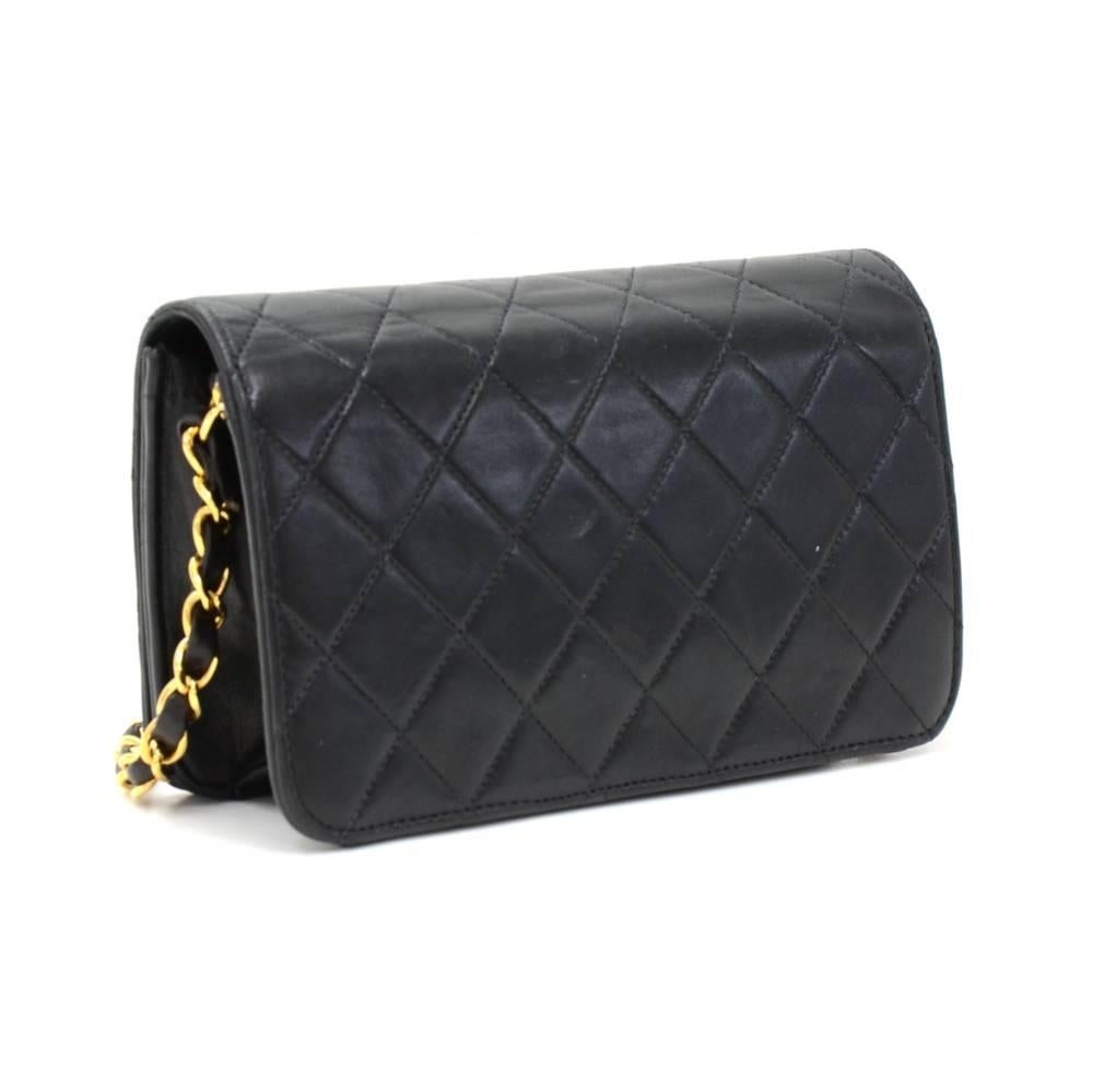 Chanel quilted mini shoulder bag in black quilted leather. It has a flap top with CC studs closure on the front. Inside has Chanel red leather lining and 1 open pocket. Comfortably carried on shoulder with single chain.  

Made in: France
Serial