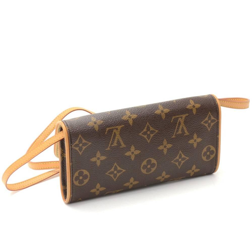 Louis Vuitton Twin Pochette PM in monogram canvas. Flap  has a magnetic closure. It can be carried as a clutch or a shoulder bag with removable natural cowhide leather strap. 

Made in: Spain
Serial Number: CA0051
Size: 7.5 x 3.5 x 1.6 inches or 19