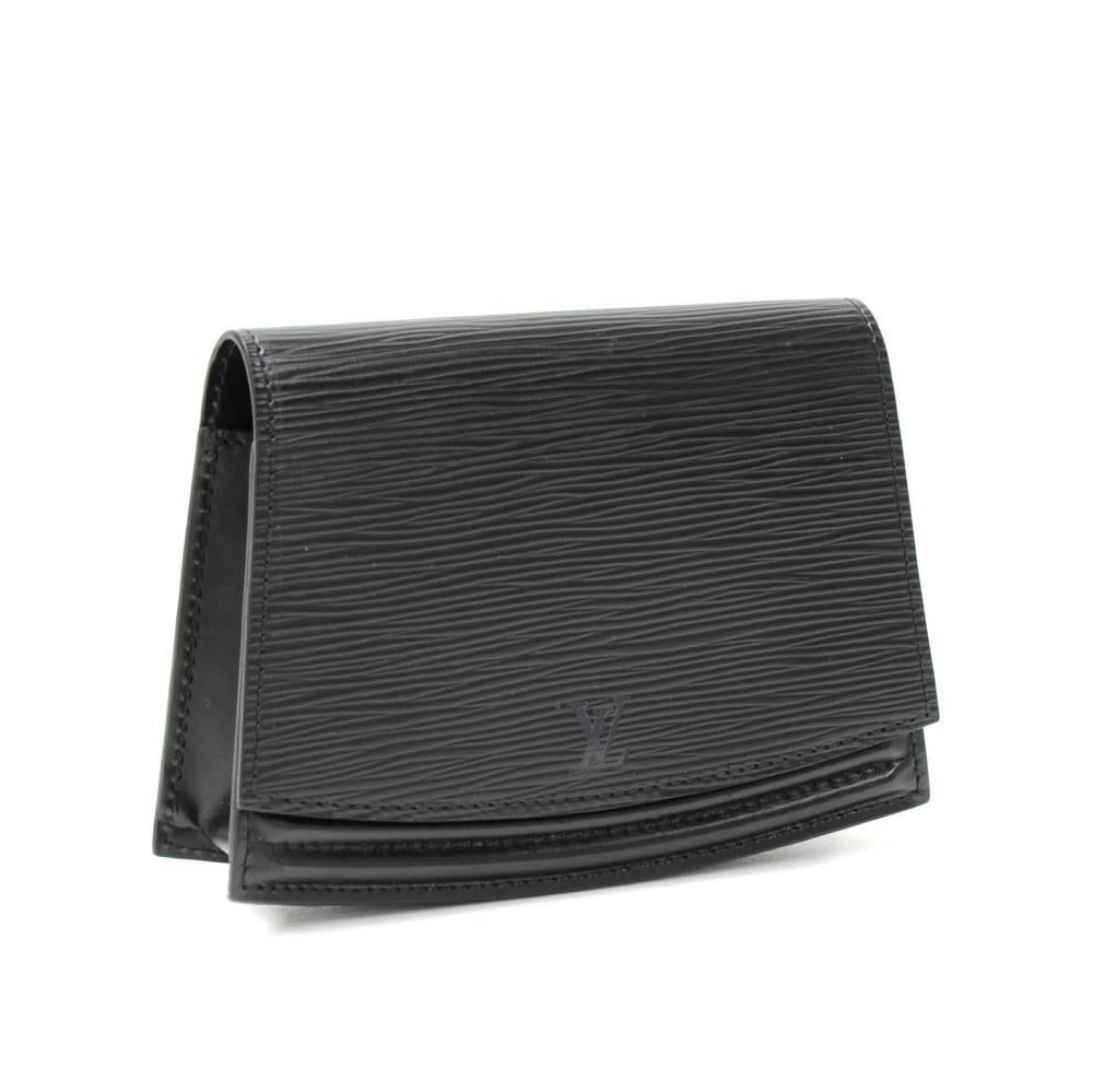 Louis Vuitton Ceinture Tilsitt Pochette in epi leather with stud closure flap. It can also be worn around the waist. Very stylish.

Made in: France
Serial Number: .V.I. 1921
Size: 6.7 x 4.7 x 1.2 inches or 17 x 12 x 3 cm
Color: Black
Dust bag:   Not