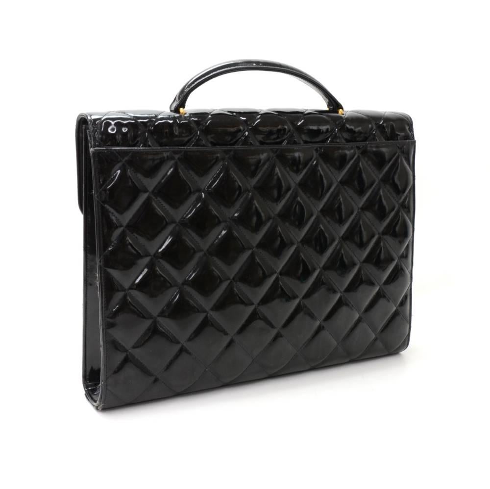 Chanel document/brief bag in Black patent leather. Top flap and twist lock closure. On the back has 1 open pocket. Inside has leather lining with 2 pockets; 1 zipper and one open. Very stylish item which would make a great statement wherever you go!