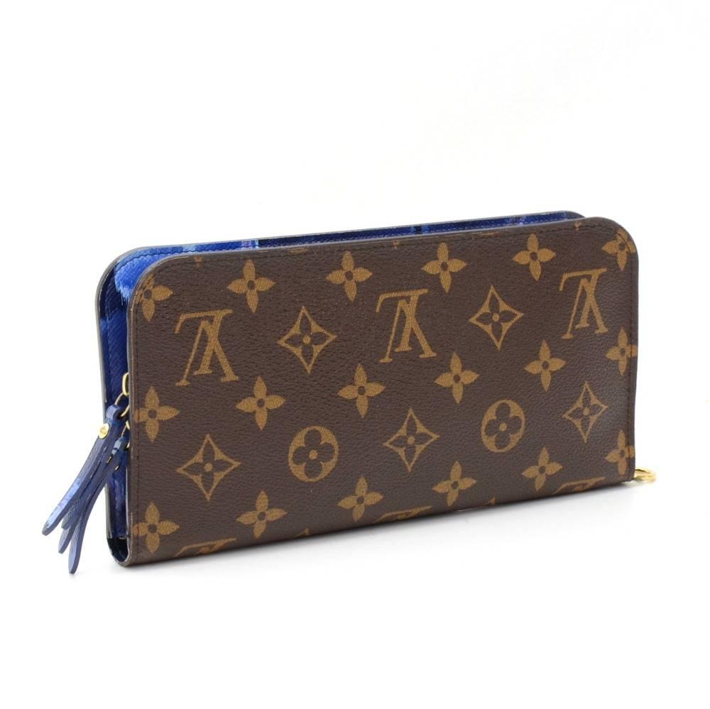 2013 Limited edition Louis Vuitton Insolite wallet in monogram canvas and double zipper closure. The words 