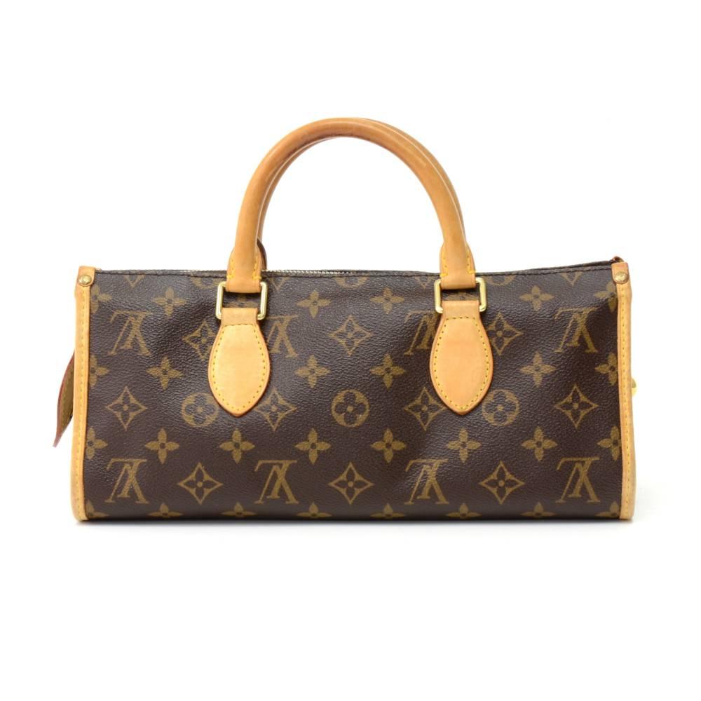 
Louis Vuitton Popincourt Monogram Canvas handbag. Top is secured with zipper. Inside is in brown canvas lining with open pocket. Carried in hand and make great companion where you go. SKU: LO431

Made in: France
Serial Number: VI0016
Size: 11.8 x