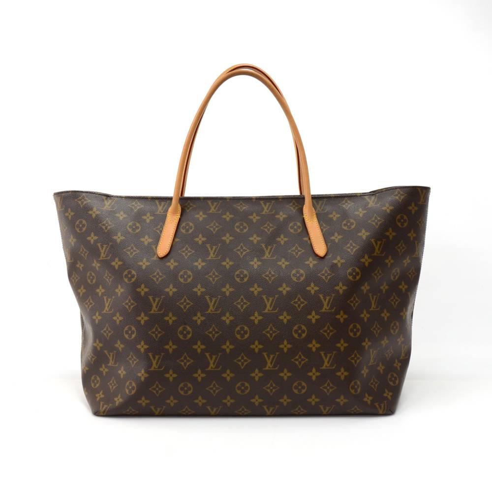 Louis Vuitton Raspail GM tote bag in monogram canvas. Main access is secured with zipper. Inside is dark purple canvas lining and 1 zipper and 2 small open pocket. Very popular design for everyday shopping.  SKU: LO443

Made in: Spain
Serial Number: