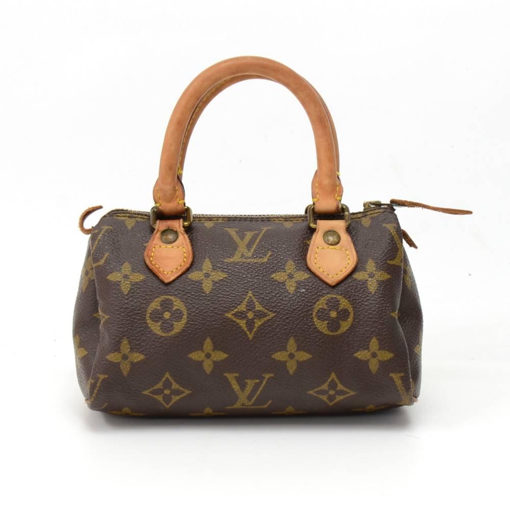Vintage Louis Vuitton handbag Mini Speedy Sac HL, one of the most popular line in LV monogram canvas. Brass zipper securing access. Inside is brown lining. Very cute item to have. Comes with a strap. SKU: LO446

Made in: France
Size: 5.9 x 3.9 x 2.8