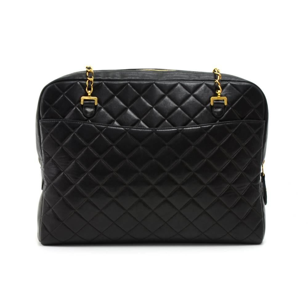 Vintage Chanel black quilted leather shoulder bag. It has zipper closure and 1 exterior open pocket on each side. Inside has Chanel red lining and 2 open pockets. Comes with a CC logo zipper tag. Comfortably carry on shoulder with chain straps and