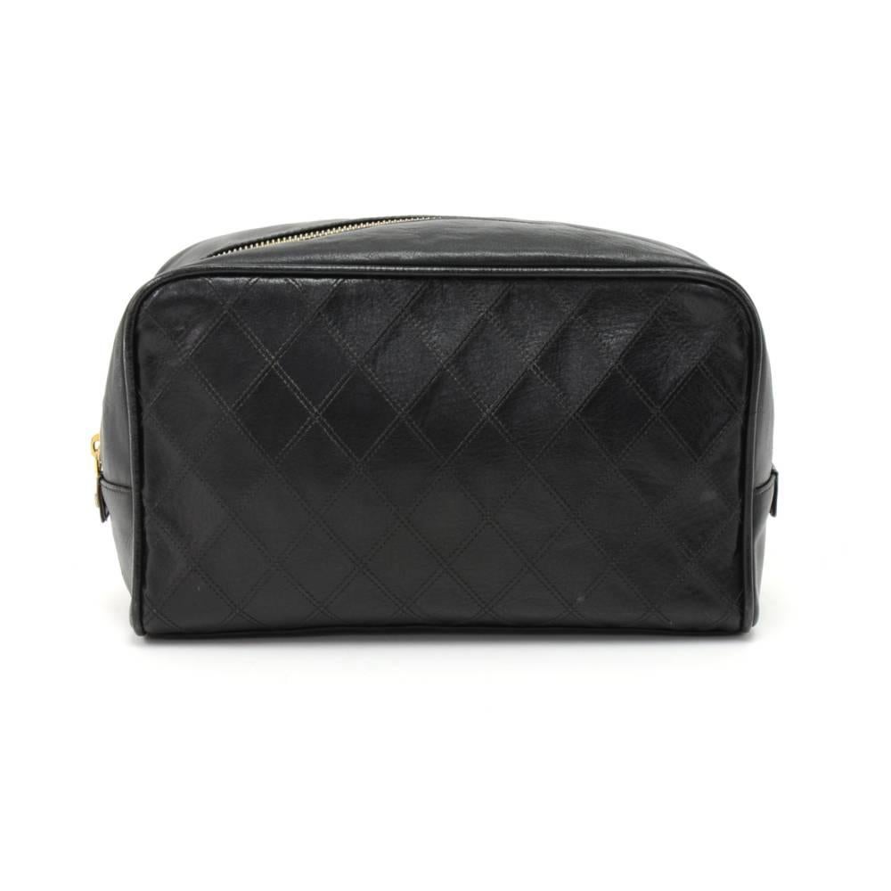 Chanel large vanity cosmetic case in black Calfskin leather. Chanel CC logo stiched to both sides.  Top is secured with zipper. Inside has black leather lining, 1 zipper pocket and 2 rubber support. Great for carrying your makeup, toiletries or