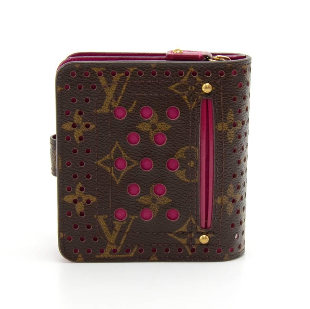 Louis Vuitton monogram canvas perforated wallet. Inside is lined with fuschia. It has coin case with zipper closure. Main compartment has 5 slots for cards and compartment for your paper bills.  Outside has one slop pocket in back. This limited