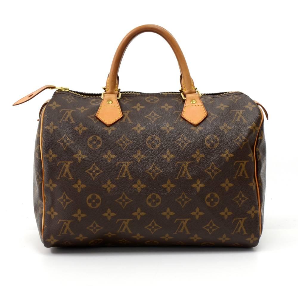 Louis Vuitton Speedy 30 hand bag crafted in monogram canvas. It offers light weight elegance in a compact format. Inspired by the famous keep all travel bag, it features a brass zip closure. Perfect for carrying everyday essentials. SKU: LO559

Made