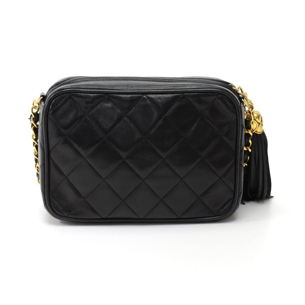 Vintage Chanel shoulder pochette/bag in black quilted leather. Top access with zipper. Has a stylish CC logo tassel zipper pull. Outside has a foldover front pocket with large CC logo. Inside has black leather lining with 1 zipper pocket.