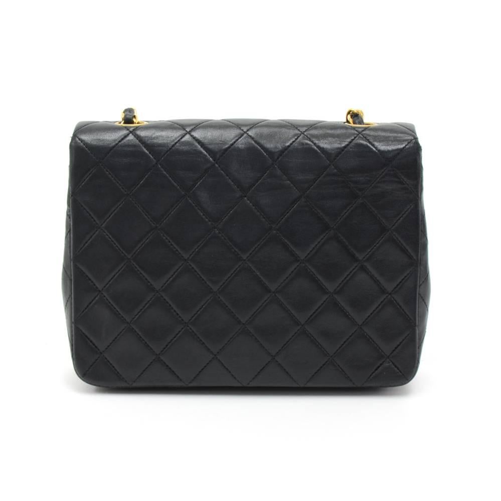 Vintage Chanel black quilted leather mini bag. It has flap and CC twist lock on the front. Inside has Chanel red leather lining and 2 pockets; 1 zipper and 1 open slit into 3 compartments. It can be used as shoulder bag or across the body. SKU: