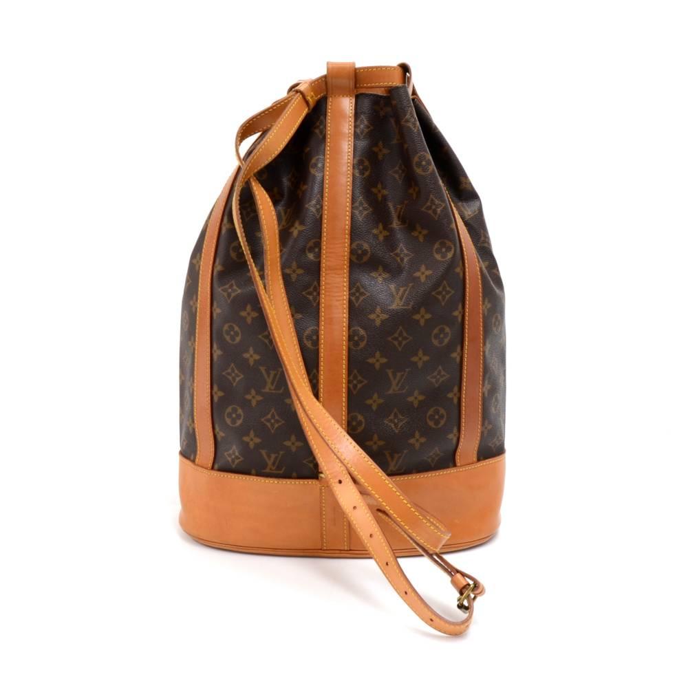 Vintage Louis Vuitton Randonnee GM in monogram canvas bag. It can be carried on one shoulder or as a backpack. Very rare to find. Comes with a detachable canvas pouch and a nametag.  SKU: LO731

Made in: France
Serial Number: A20970
Size: 13 x 18.9