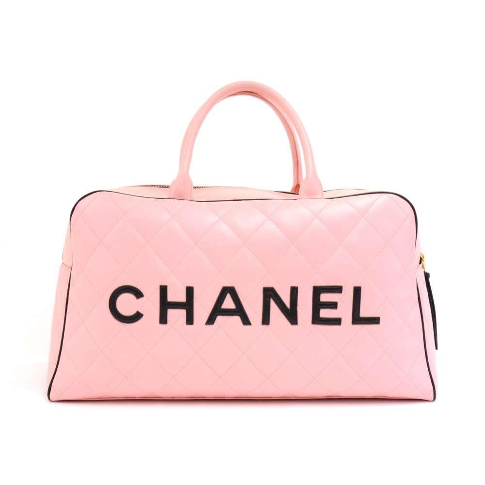 Vintage Chanel Pink Calfskin leather Boston bag with diamond quilted leather and a black trim and piping. Outside has 