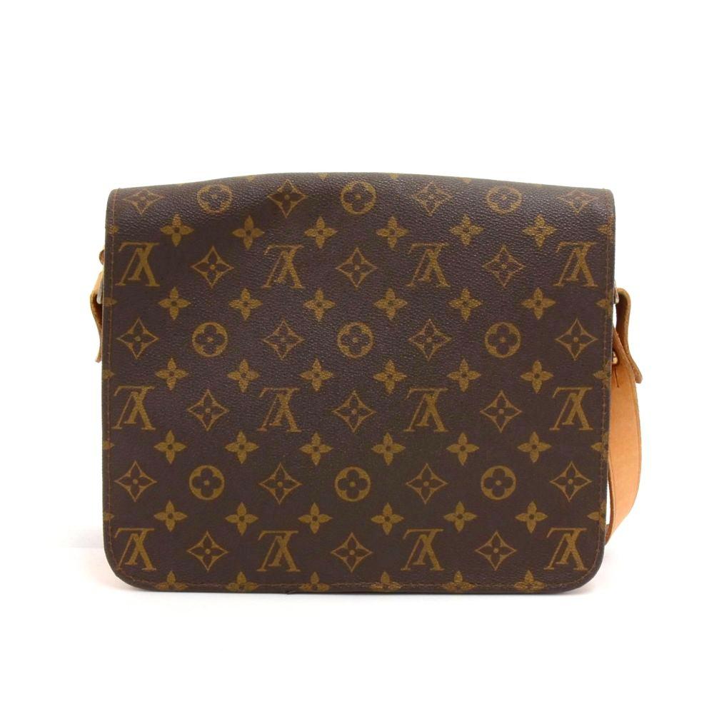 Vintage Louis Vuitton Cartouchiere GM shoulder bag in monogram canvas. The top flap is secured with a belt closure. It can be comfortably carried on the shoulder or across the body with the adjustable shoulder strap. Great for you daily or traveling