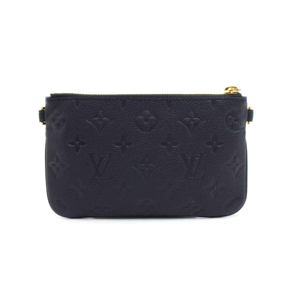 Louis Vuitton Citadine Pouch Bag in Navy Empreinte leather. It is the mini pouch that comes with the Citadine bag. This bag pouch is the perfect size to store your money, accessories, makeup, or other items. Can be attatched to bags with the two
