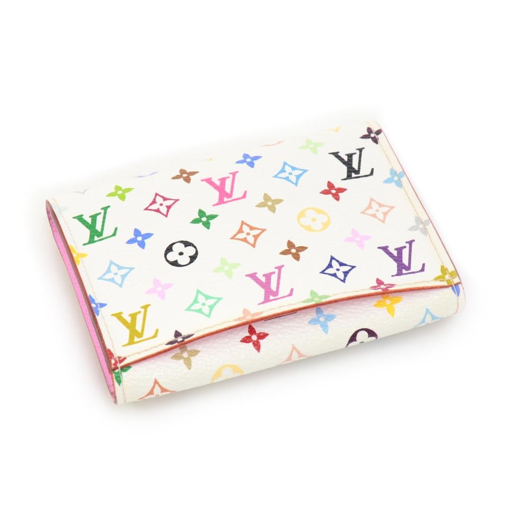 Louis Vuitton white multicolor monogram pochette key / coin case. This key case can holds coins and keys! Stunning item where you go.

Made in: Spain
Serial Number: CA1151
Size: 4.1 x 0.6 x 3.1 inches or 10.5 x 1.5 x 7.8 cm
Color: White
Dust bag:  
