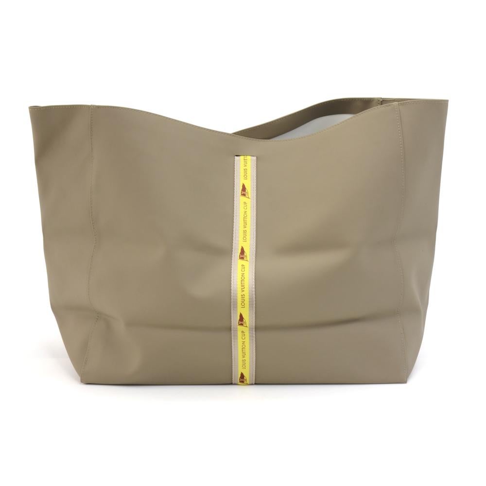 Louis Vuitton Gray LV Cup limited edition tote. Water resistant material inside designed to be used around water. This item is collectors item and is rare to find. SKU: LP643

Made in: France
Serial Number: No visible date code
Size: 15 x 6.1 x 12.4