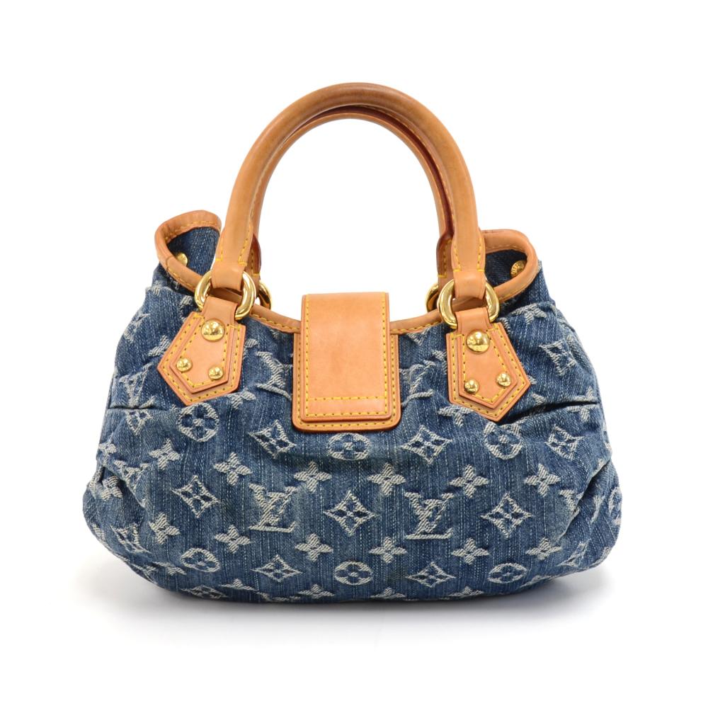 Louis Vuitton Pleaty handbag in Denim Monogram. It rounded cowhide leather details and handles. The top has a small top flap with a push lock closure. The inside is lined with lovely yellow wuede leather and has one pocket. Can be carried in hand.