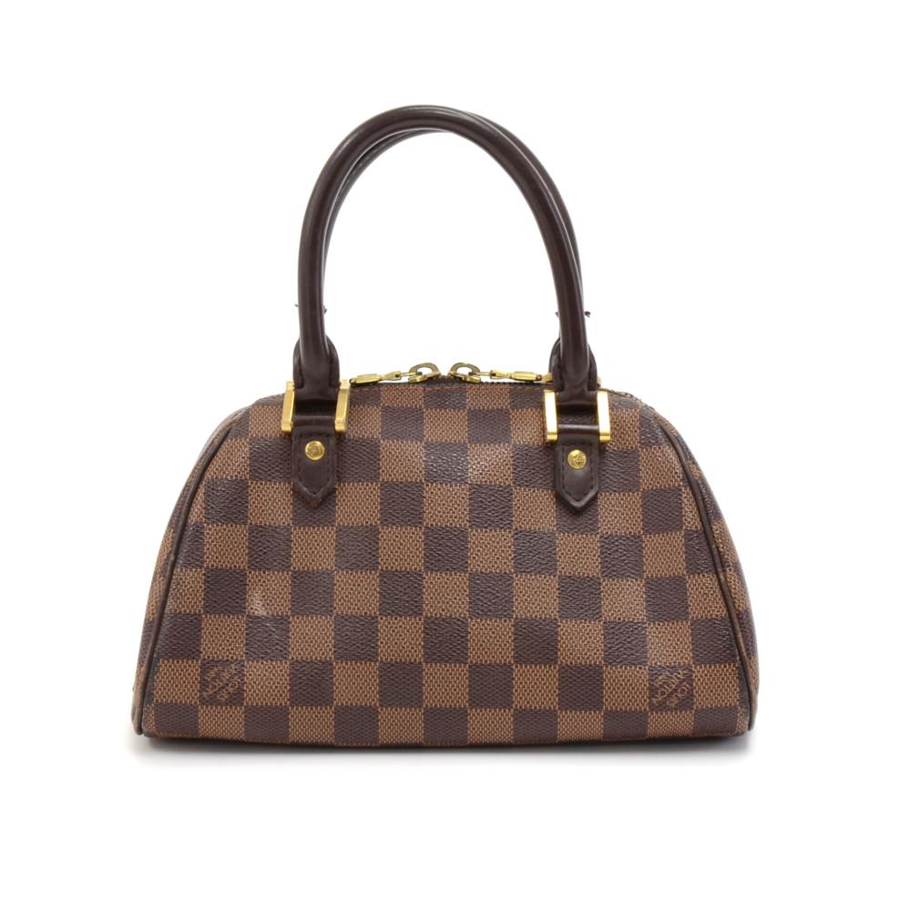 Louis Vuitton Mini Ribera hand bag in damier Canvas. Top is secured with double zipper. Inside is in orange canvas lining with 1 open pocket. Perfect for daily use or night out. SKU: LQ089

Made in: Spain
Serial Number: CA0091
Size: 8.7 x 4.7 x 5.1