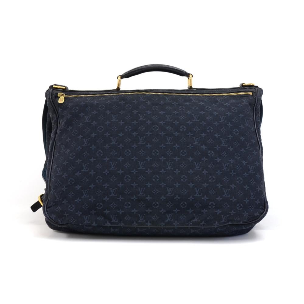 Louis Vuitton Denise Messenger bag in navy monogram mini lin canvas and navy leather trim and details.  This bag 2 large compartments attached by belts on the sides. The front compartment has a flap opening with two belt closures with gold hardware
