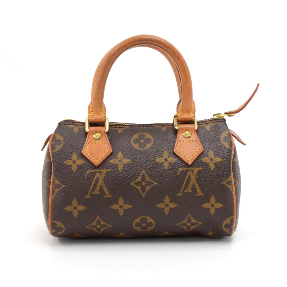 Authentic Louis Vuitton handbag Mini Speedy Sac HL, one of the most popular line in LV monogram canvas. Brass zipper securing access. Inside is brown lining. Very cute item to have.  SKU: LQ274

Made in: France
Serial Number: TH0010
Size: 5.9 x 2.8
