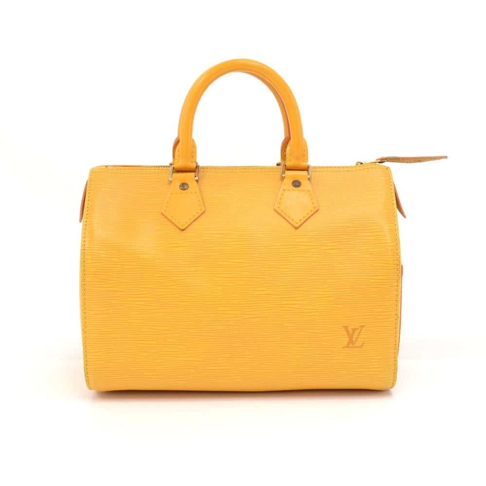 Vintage Louis Vuitton speedy 25 handbag in yellow epi leather. Inspired by the famous keep all travel bag, it has zip closure. This bag in Epi leather is perfect for carrying everyday essentials. One of the most popular shapes from Louis Vuitton.