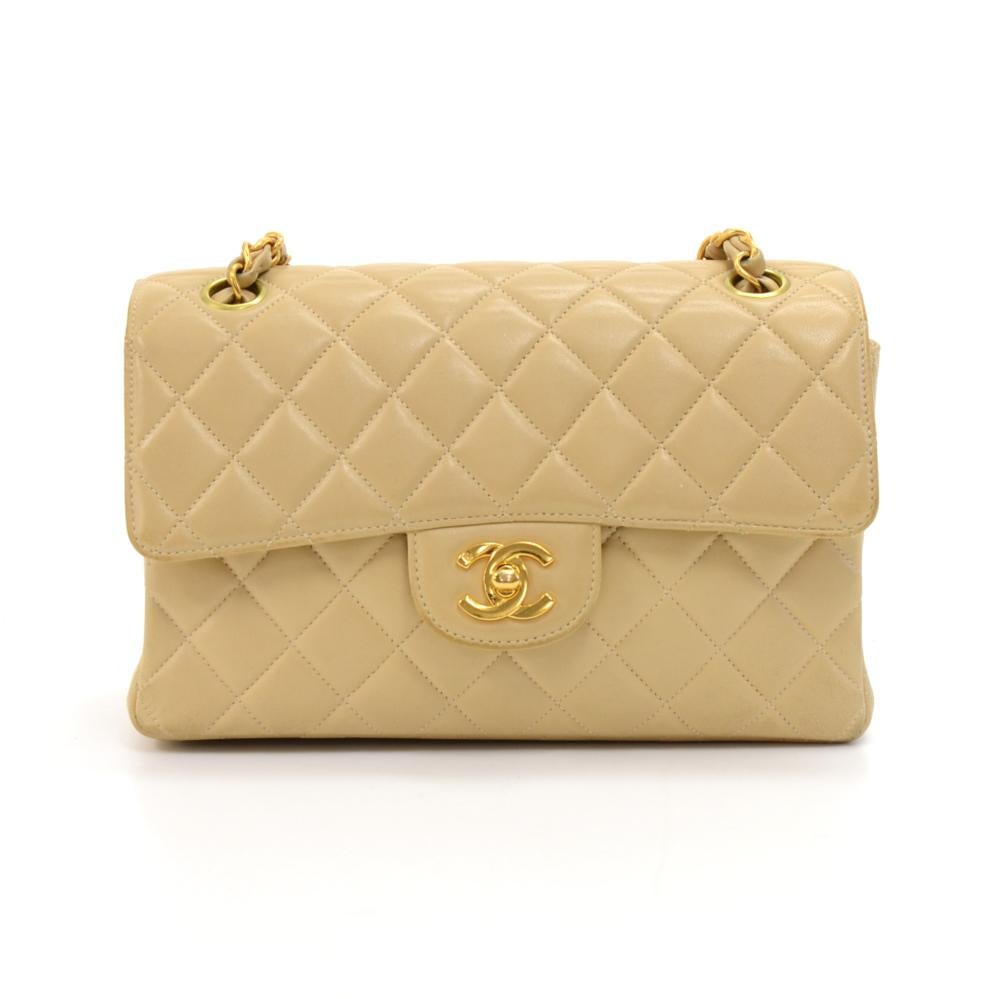 Very rare Chanel double sided flap bag in beige quilted leather.The bag is divided into two compartments, with a flap opening for each side of the bag. Both openings are secured with a CC twist lock. Inside is lined with the same beige lining. One