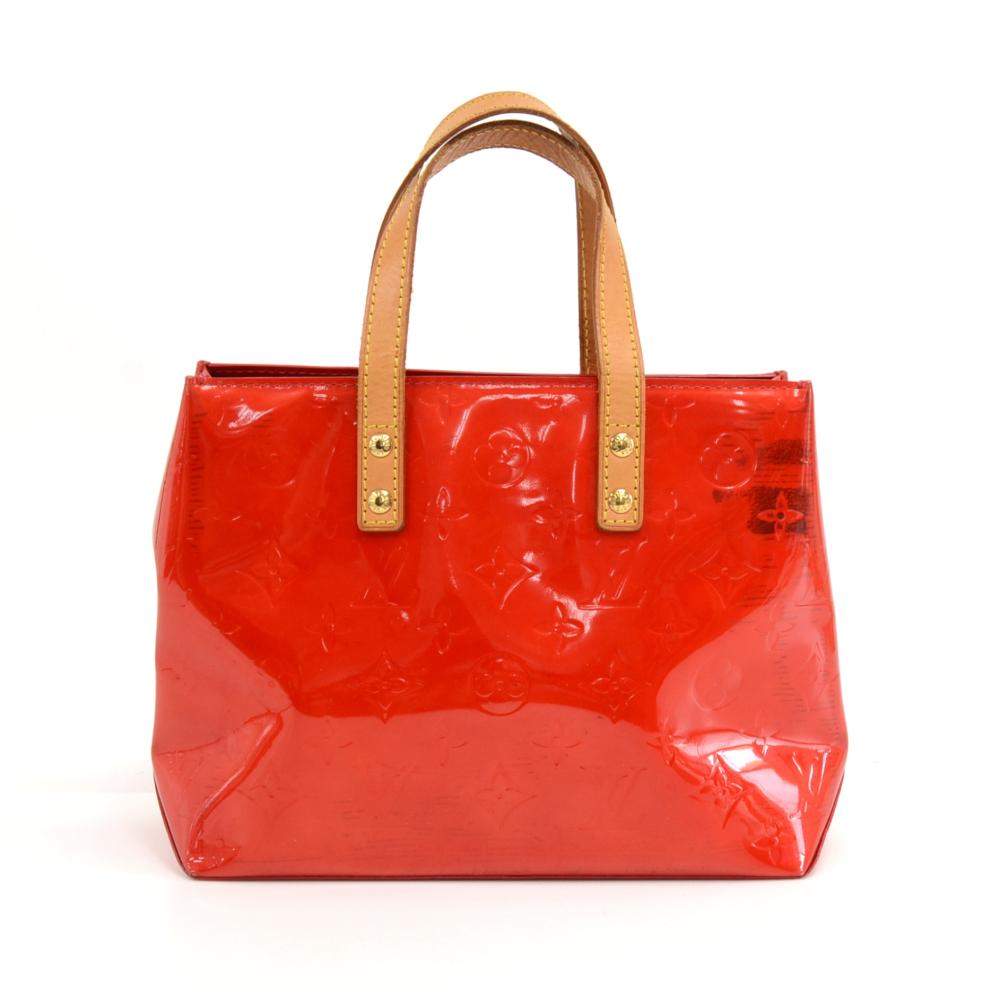 Louis Vuitton Reade PM in red Vernis leather. Inside has 1 side pocket secured with a zipper. Simply carried in hand and has easy open top access. Beautiful bag perfect for shopping, night out or a date.SKU: LQ163

Made in: France
Serial Number:
