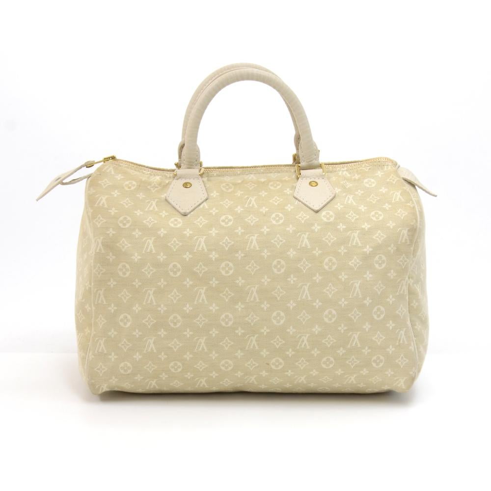 Louis Vuitton Speedy 30 bag in mini monogram canvas. It offers light weight elegance in a compact format. Inspired by the famous keep all travel bag, it features a zip closure. This hand held bag is perfect for carrying everyday essentials. SKU: