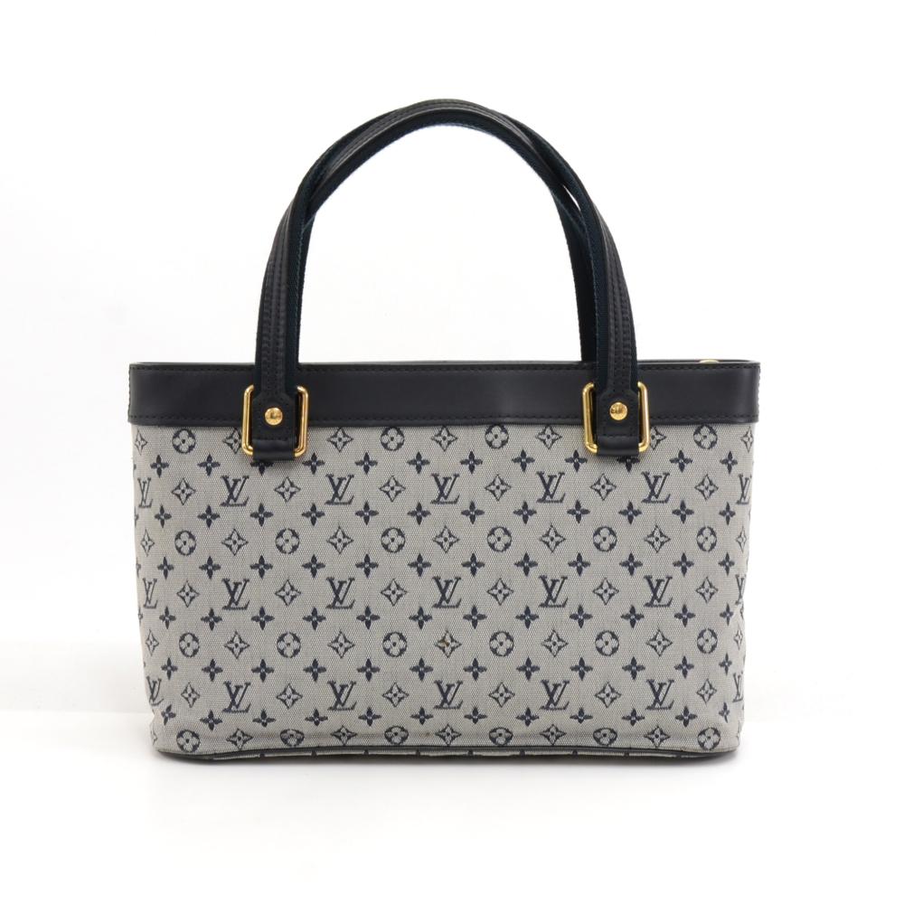 Louis Vuitton Lucille bag in mini monogram canvas. Outside has 1 zipper pocket on the front. The top is secured with zipper. Inside has a fabric lining and 2 open pockets. Lovely gold-tone hardware. Can be carried in hand, on arm, or on the