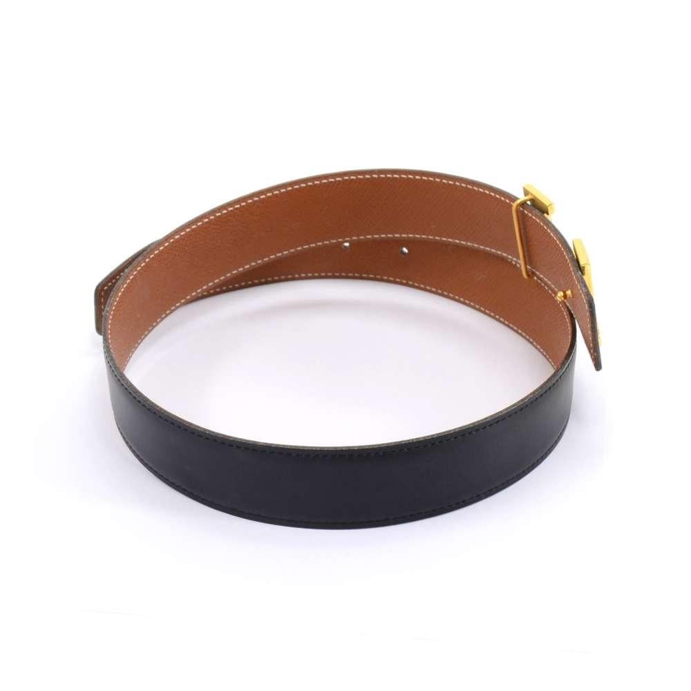 Vintage Hermes belt that is reversible with black and brown leather and the iconic H buckle. Smooth leather in black color. 