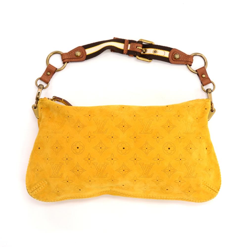 Louis Vuitton Onatah Pochette hand bag in yellow fleurs suede leather. Top is zipper closure. Inside in dark brown monogram patterbed lining with 1 open pocket. Shoulder strap is detachable to make it a clutch. Limited and cute item from Louis