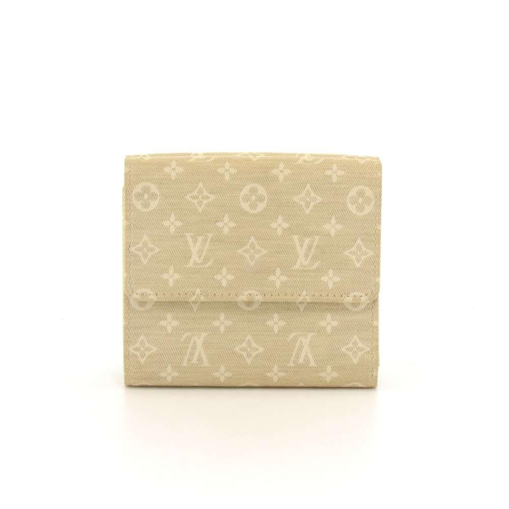 Louis Vuitton Trifold Wallet in Monogram Idylle. It has a half flap with two snap button closures on both sides. The inside has a off white canvas lining. One side opens up to 6 card slots, a pocket for your notes & receipts, and 2 slip pockets. The