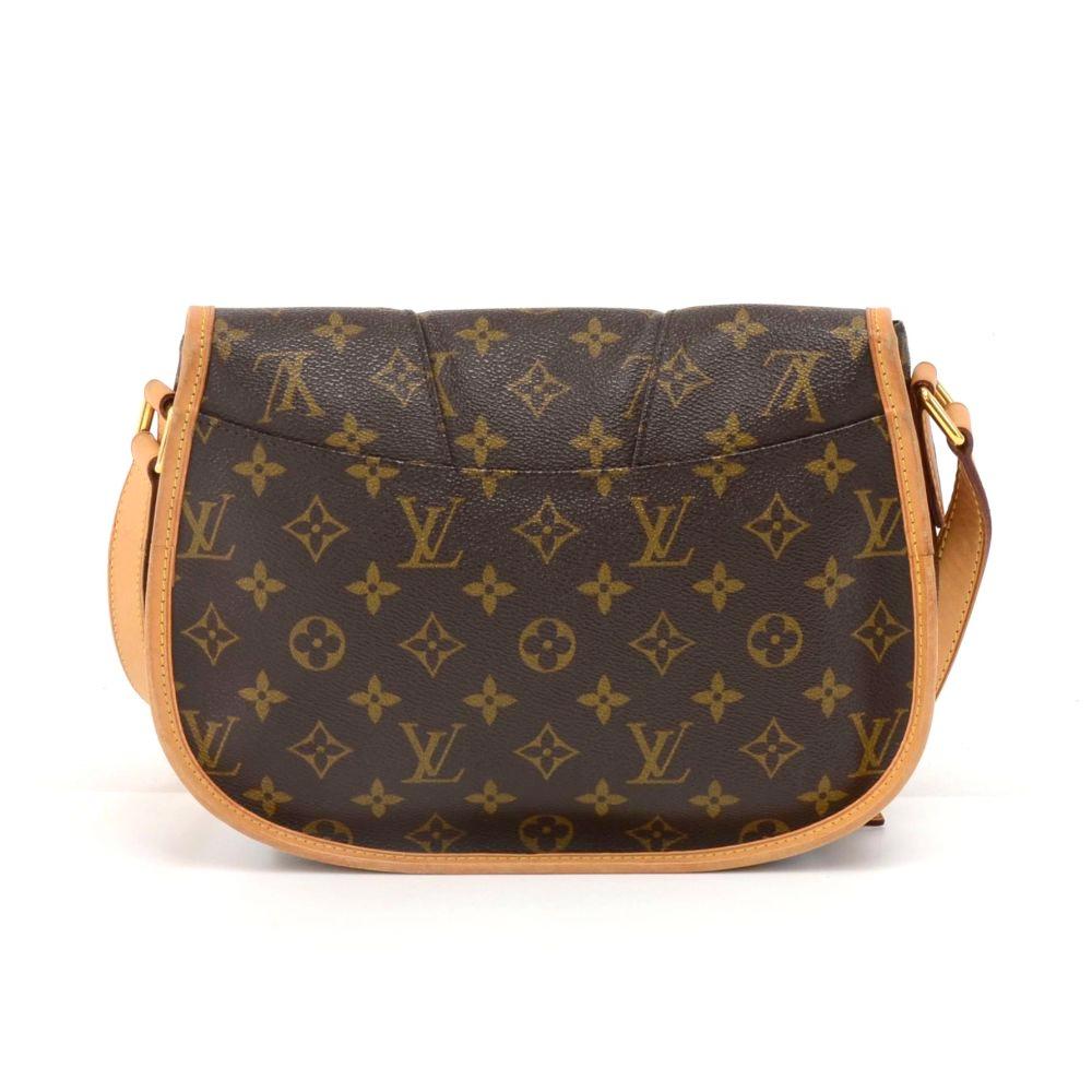 Louis Vuitton Menilmontant PM shoulder bag in monogram canvas. It has flap with 2 magnetic closures. Inside is in canvas lining with 2 exterior open pockets and 1 interior zipper pocket. Comfortably carried on shoulder or across the body with the