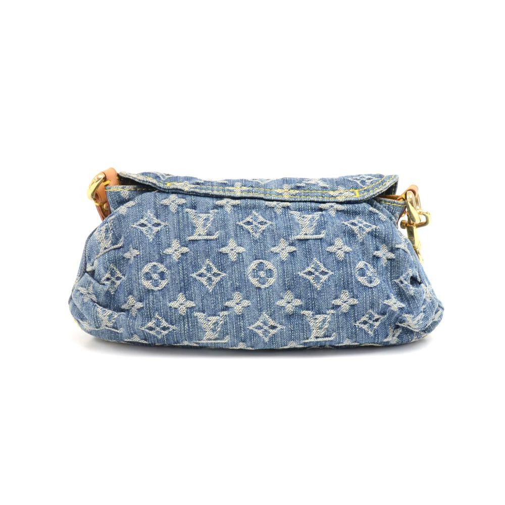 Louis Vuitton Mini Pleaty shoulder/ handbag in Denim Monogram. It has flap with a gold-tone push lock. Inside is in lovely yellow suede leather lining with 1 slip pocket. Can carry in hand or on the shoulder. Perfect for daily use or night out. 