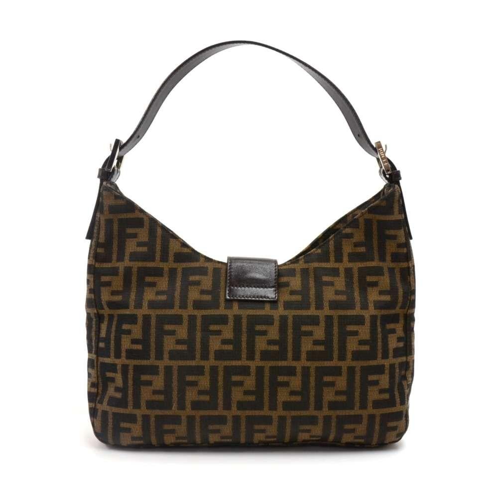 Fendi Tobacco Zucca hobo bag. Has the classic monogram tobacco Zucca canvas with brown leather details. The front has a large silver-tone buckle with the classic double F Fendi logo. The belt is secured with a magnetic closure. Inside is in dark