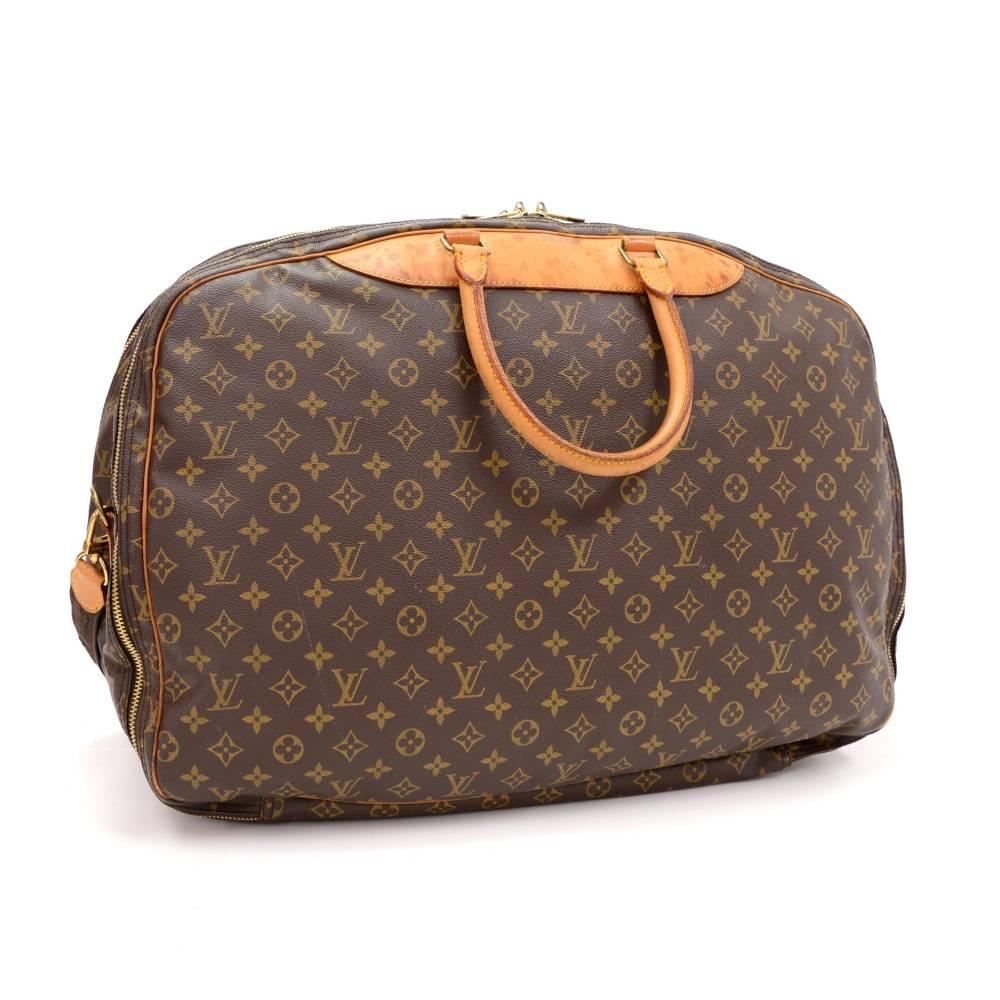 Louis Vuitton Alize 3 poches large travel bag. It has 3 compartments all with double zippers. One of the side compartment has a rubber strap to keep clothing organized in place and a large pocket in the other side compartment. Perfect size for