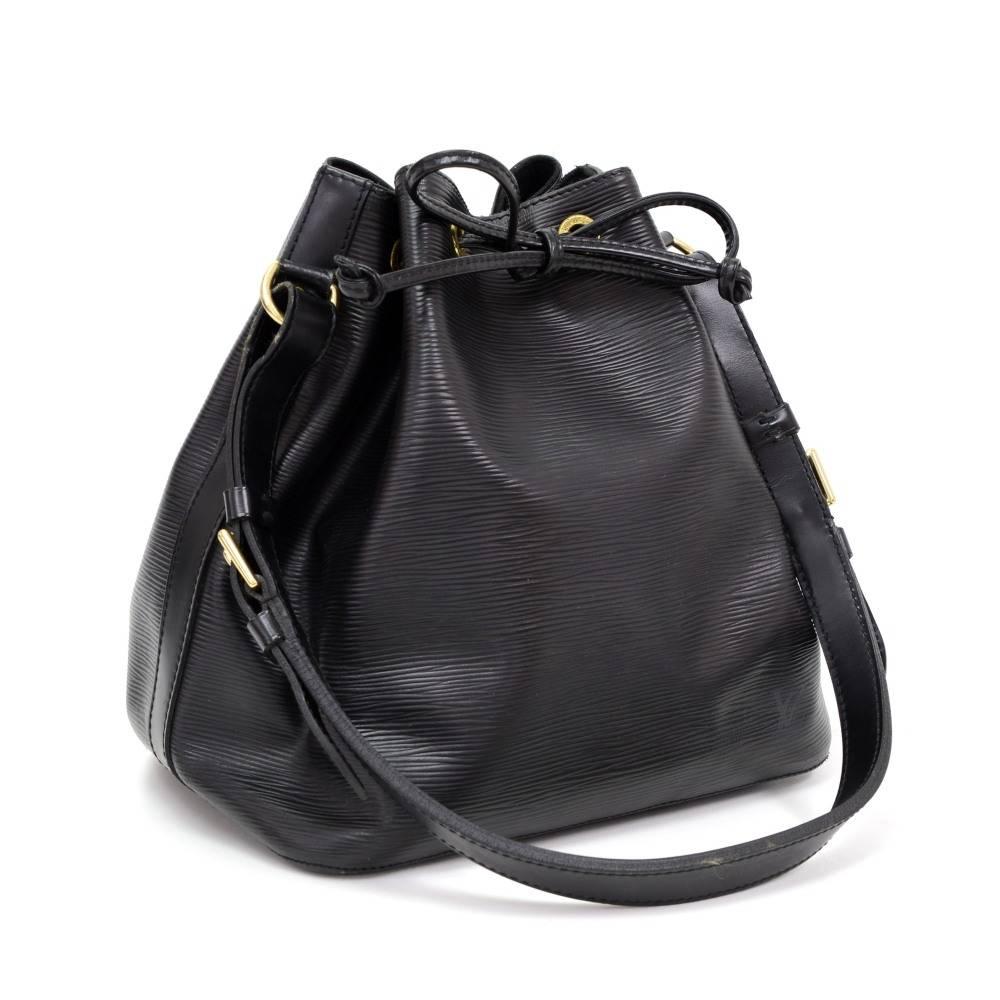 Louis Vuitton Petit Noe a smaller-scale interpretation of the famous champagne bag created in 1932. Petit Noé is styled in Epi leather. Leather strap closure, adjustable shoulder strap. Comfortably carried on one shoulder or in hand. Perfect for