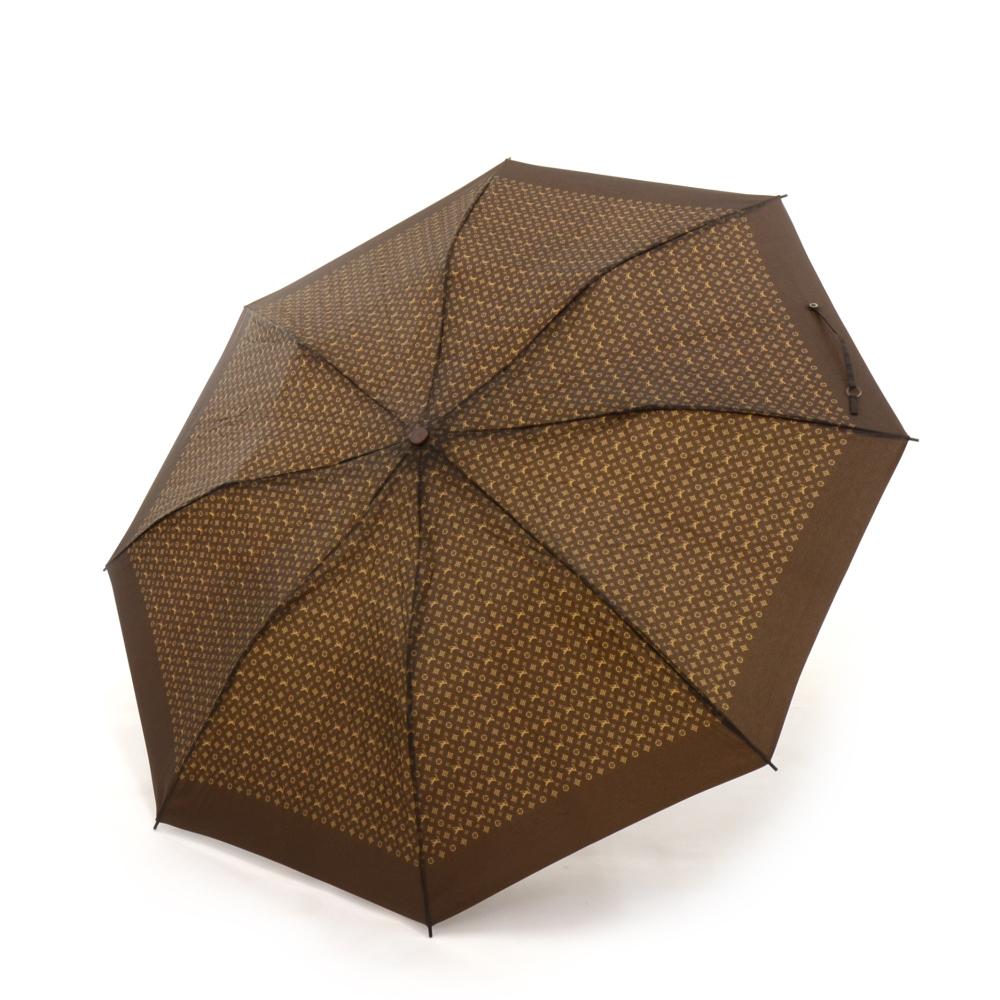 Louis Vuitton dark brown monogram folding umbrella. Comes with a monogram cover that fits the folded umbrella.100% Polyester. Umbrella approximate diameter: 36.2 in or 92 cmThe width of the handle: 1.4 in or 3.5 cmAn added fashion statement for
